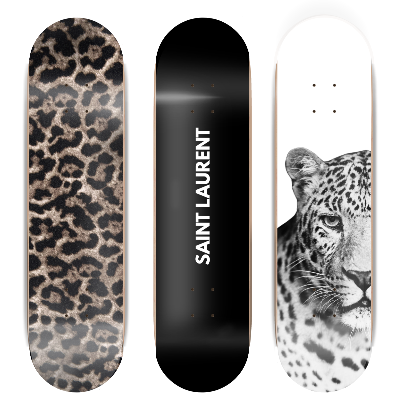 Three skateboard decks with different designs on a white background