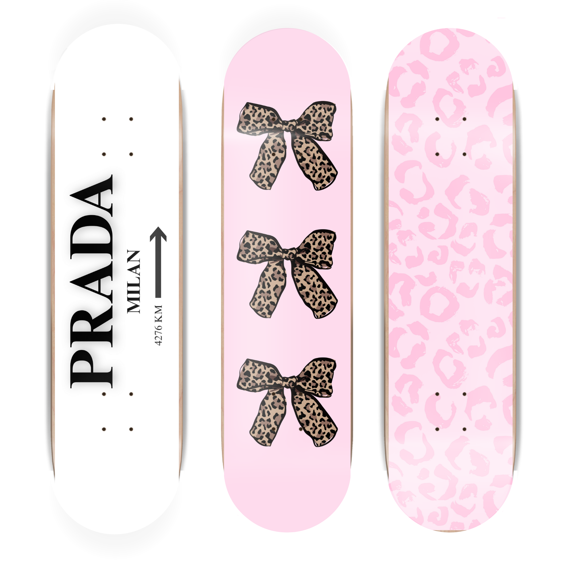 Three skateboard decks with Prada and pink designs on a white background