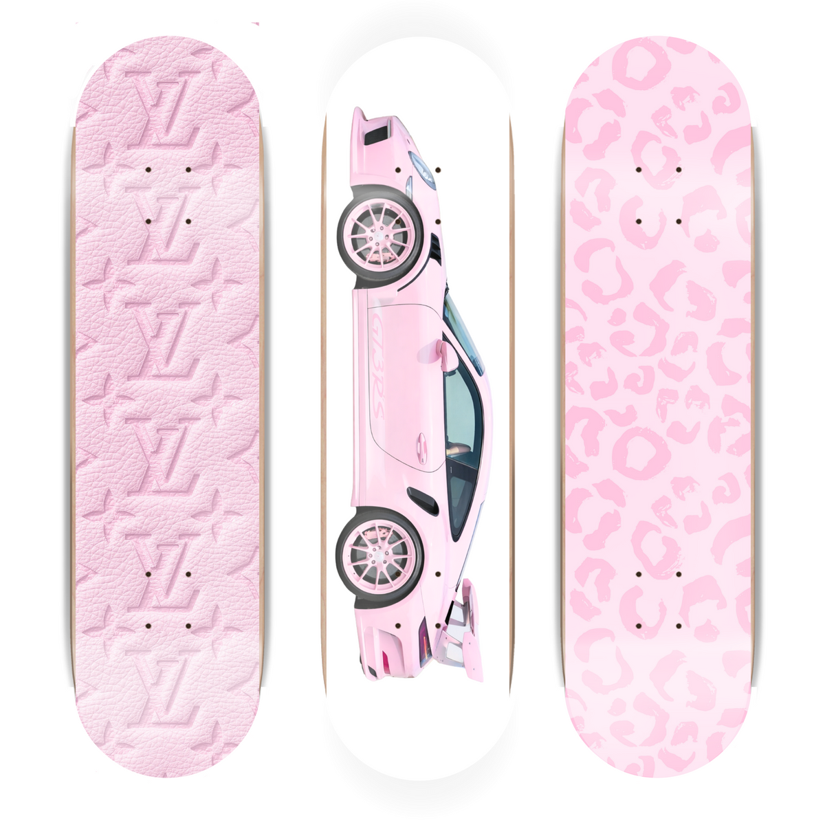 Three pink skateboard decks with different designs on a white background